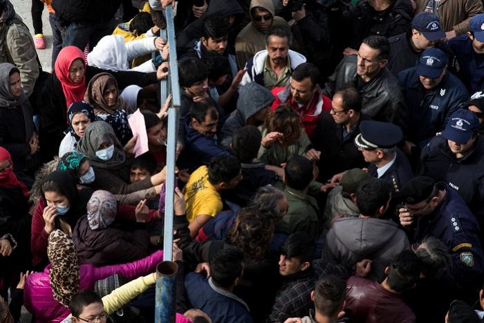 Stranded migrants in Greek camp protest over living conditions 